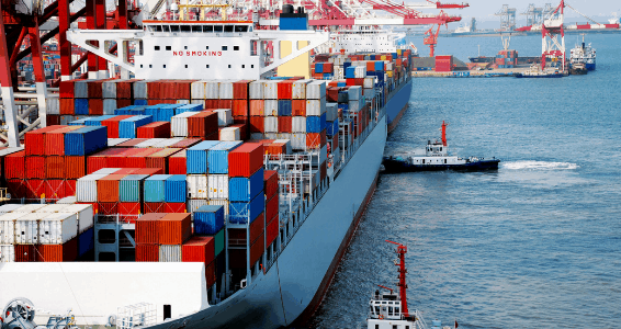 Full shipping vessel docked